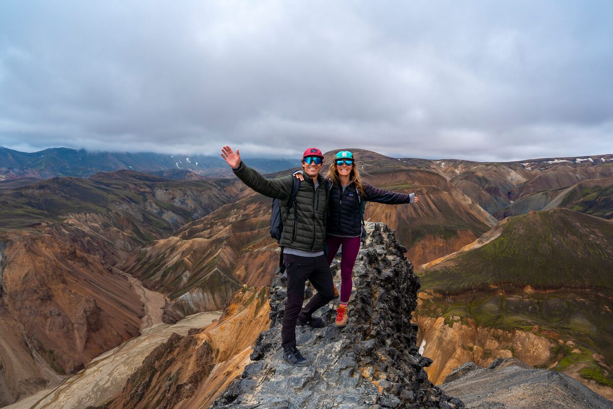 Two hikers on a mountain ridge in Iceland.