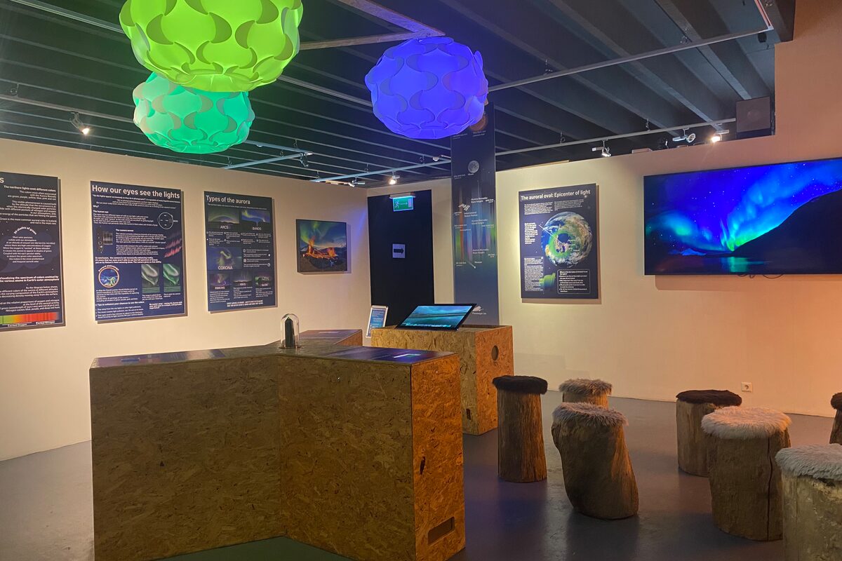 exhibition room with interactive displays and decor related to the aurora borealis